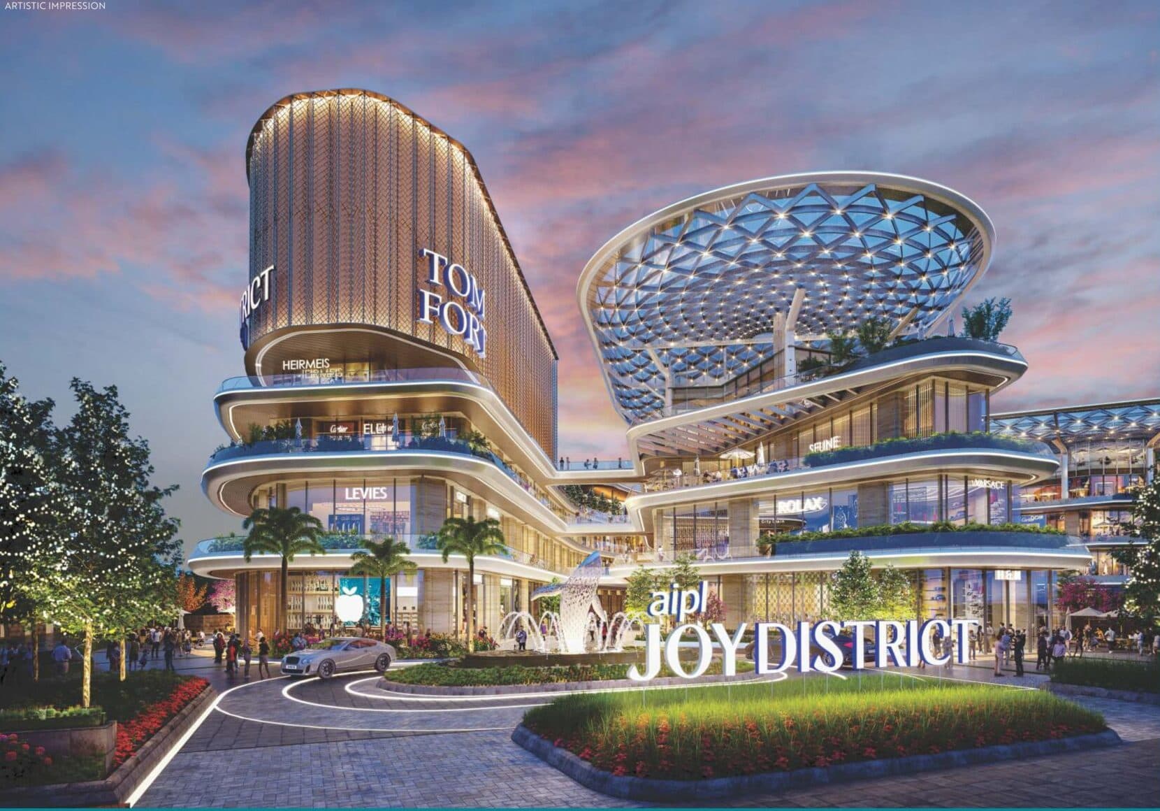 A stunning modern commercial mall with glass exteriors at dusk.
